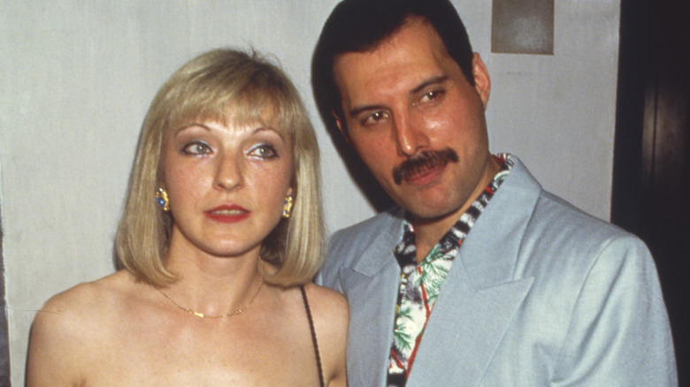 Freddie Mercury and Mary Austin posing for cameras