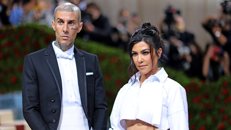 Travis Barker, Kourtney Kardashian posing