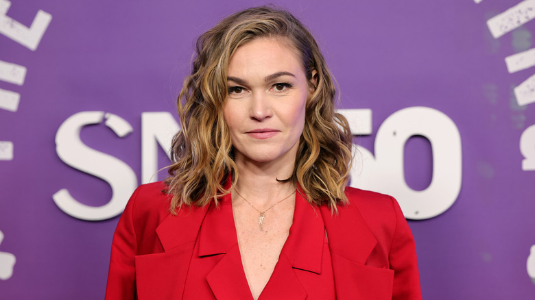 Julia Stiles wearing a red blazer