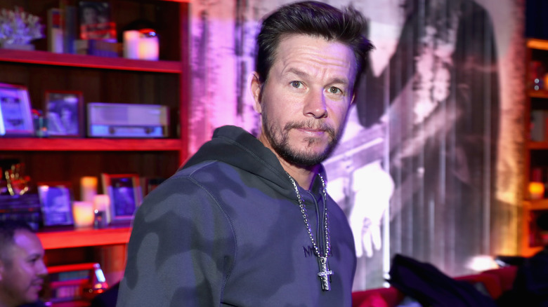 Mark Wahlberg hoodie cross necklace