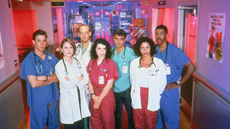 "ER" cast posing on set.