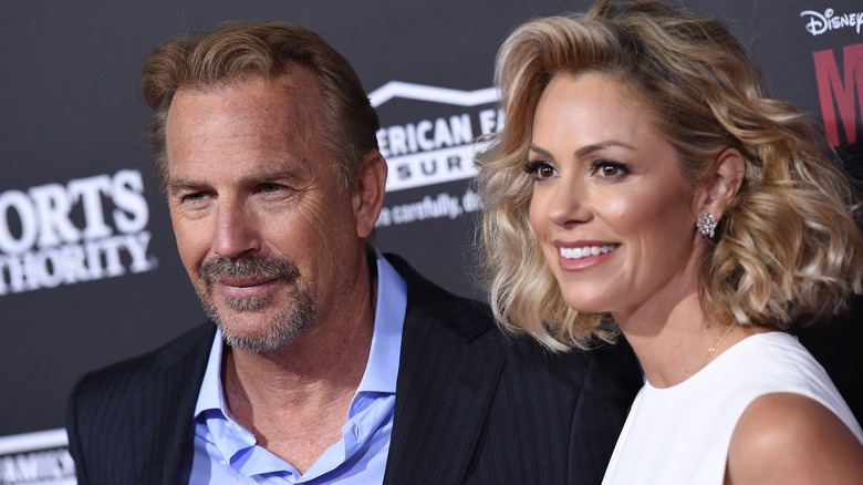 Kevin Costner and Christine Baumgartner smiling