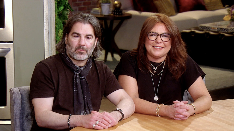 Rachael Ray and John Cusimano sit at a table during 2021 event