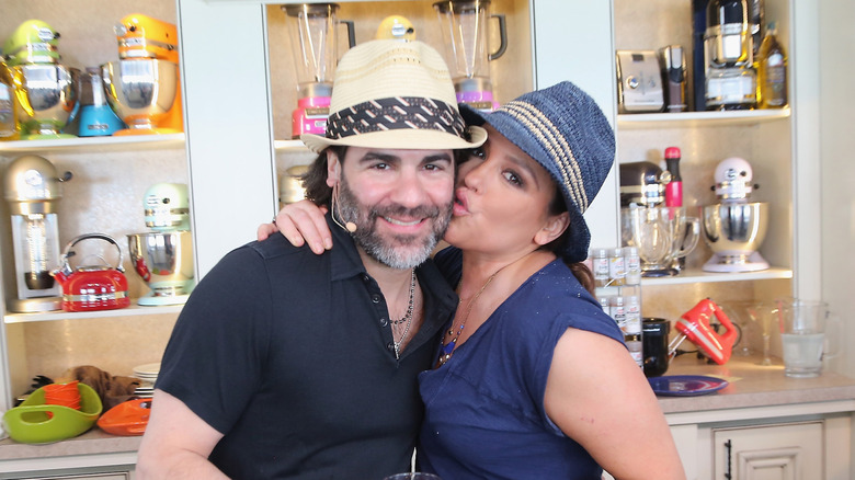 Rachael Ray kisses John Cusimano on the cheek during culinary demonstration in 2015