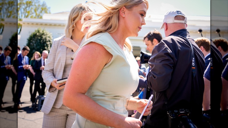 Karoline Leavitt walking back to the West Wing after speaking to reporters