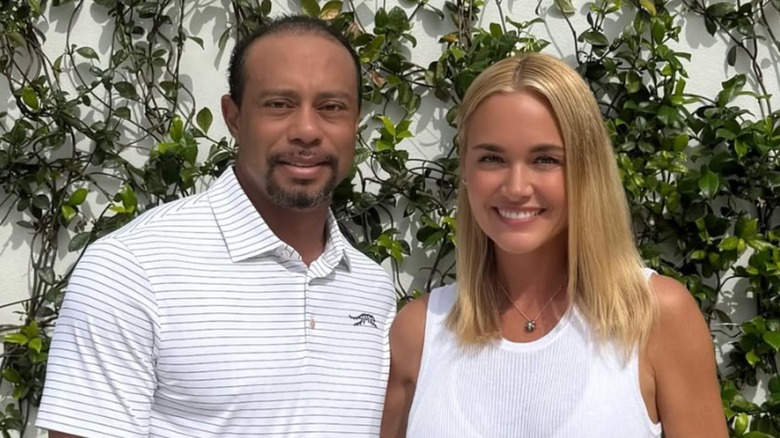 Tiger Woods and Vanessa Trump smiling