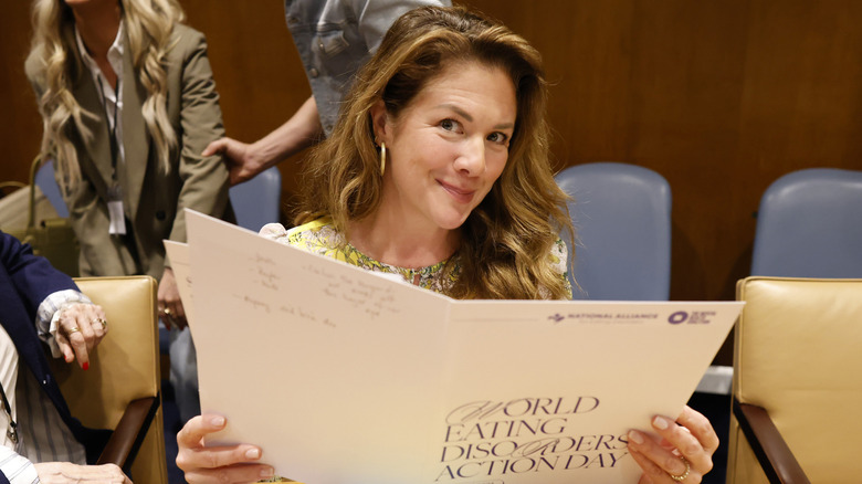 Sophie Gregoire poses while reading a document