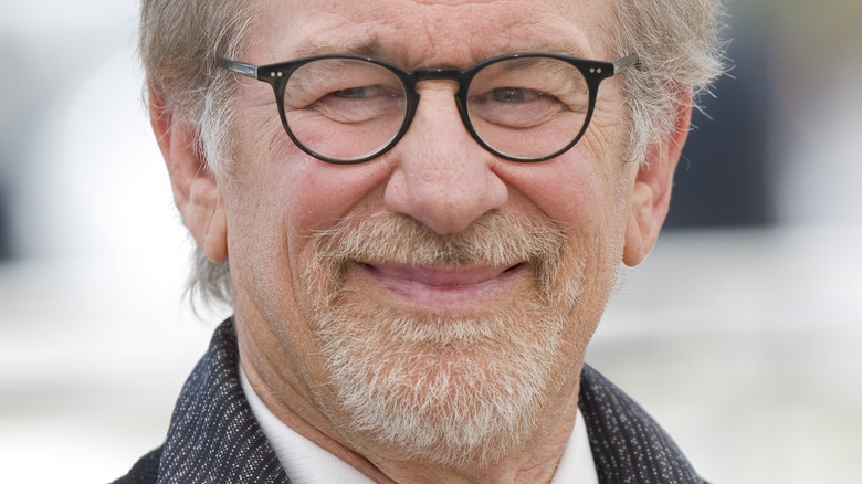 Steven Spielberg smiles at a movie premiere