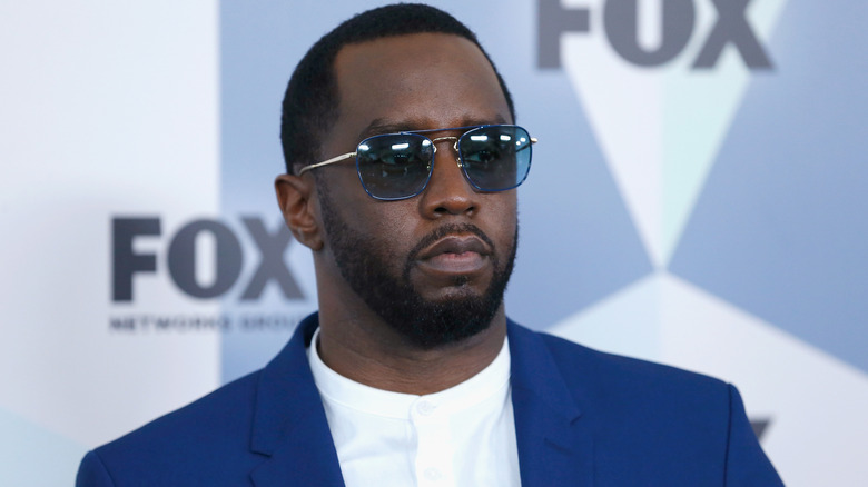 Diddy wearing a blue suit
