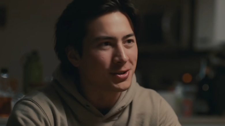 Hudson Williams in the short film Snow Angel wearing a tan hoodie