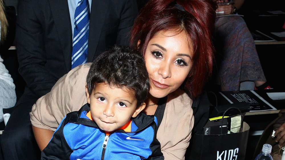Snooki and son Lorenzo attending Kids Rock! fashion
