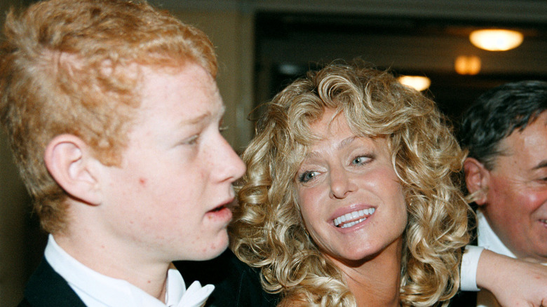 Farrah Fawcett looks adoringly at Redmond O'Neal in 2001.