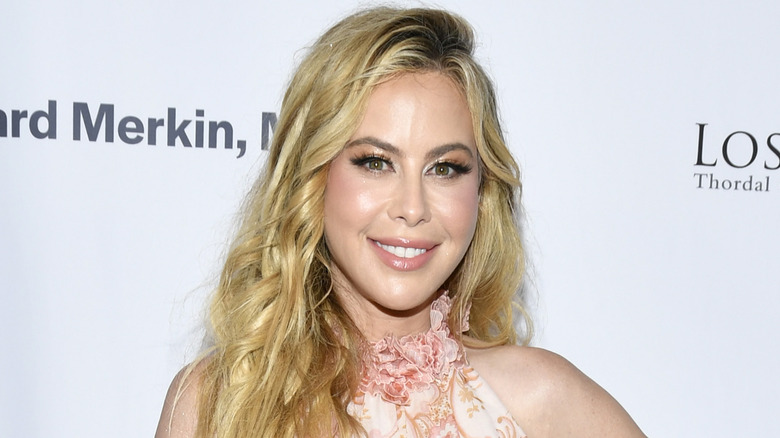 Tara Lipinski poses in rose dress