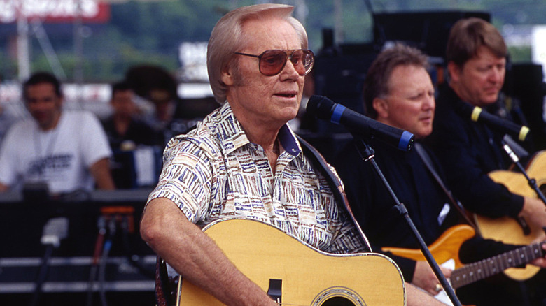 George Jones performing on stage in 1999.