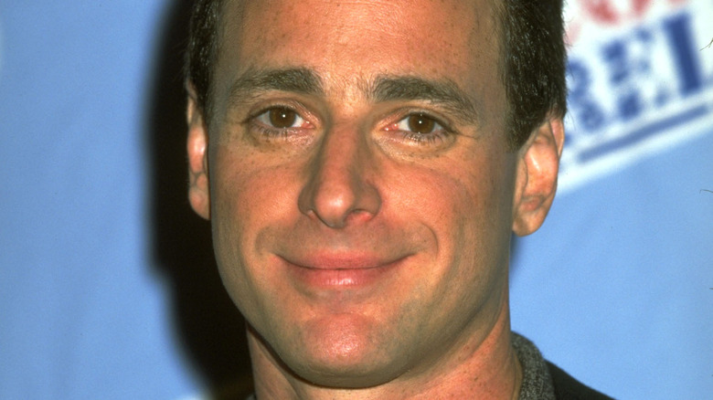 A young Bob Saget smiling 
