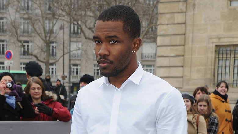 Frank Ocean wearing a white collared shirt outdoors in Paris