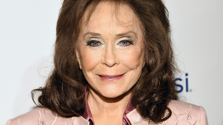 Loretta Lynn in pink outfit