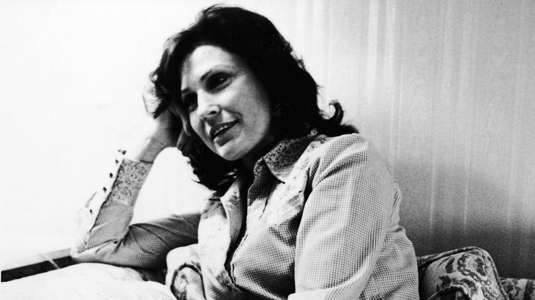 Loretta Lynn on a couch