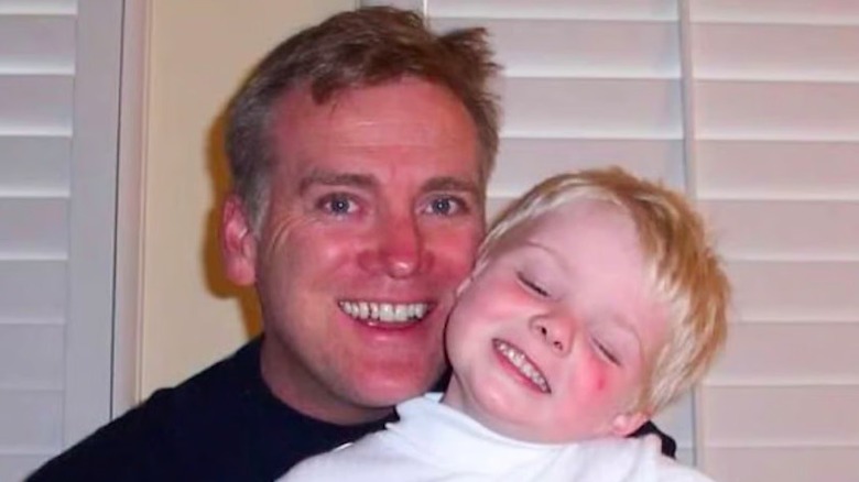 Young Alex Warren with his father