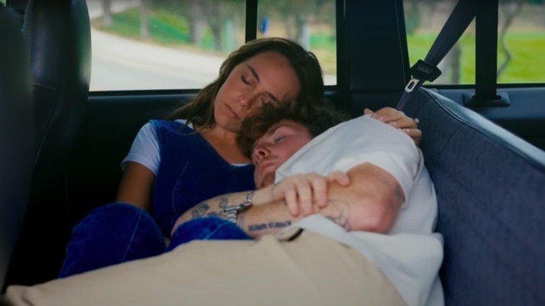 Alex Warren and Kouvr Annon sleeping in a car