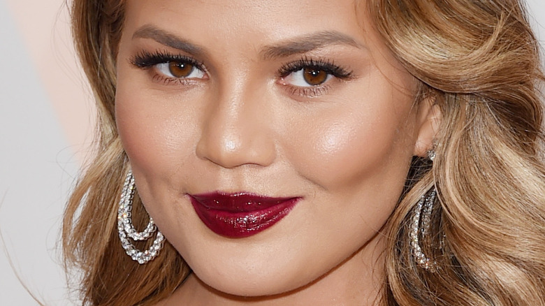 Chrissy Teigen wearing red lipstick