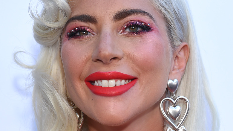 Lady Gaga poses with colorful makeup