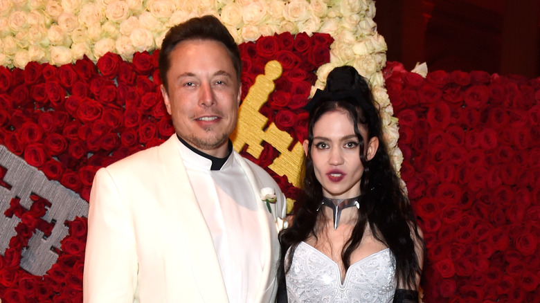 Elon Musk and Grimes at an event
