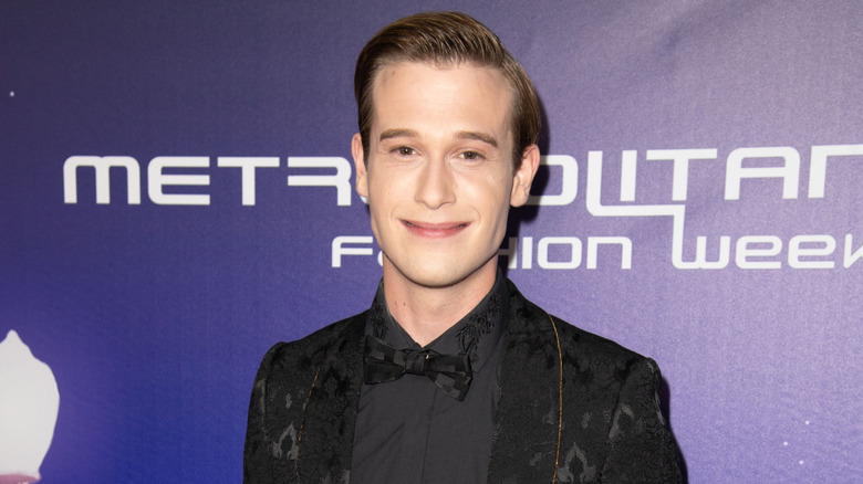 Tyler Henry smirking red carpet