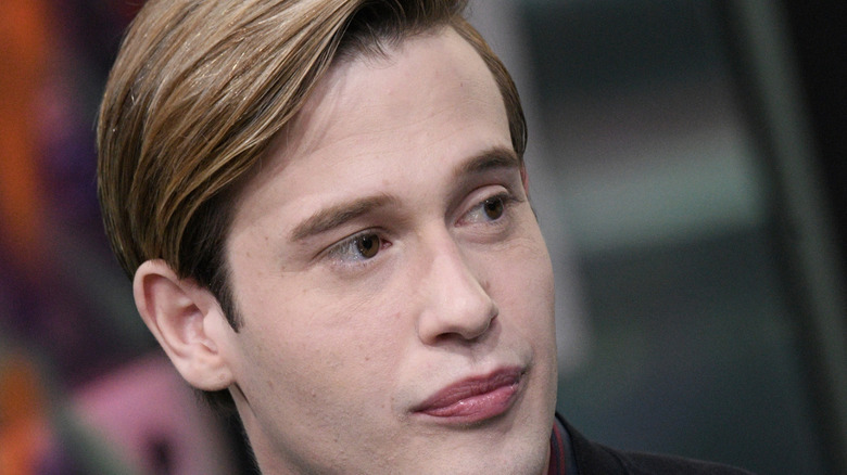 Tyler Henry looking left serious