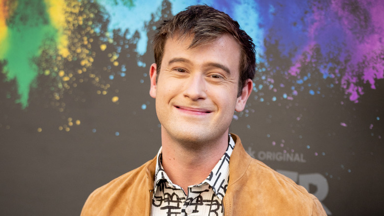 Tyler Henry smiling messy hair