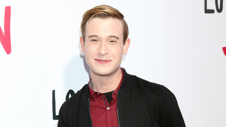 Tyler Henry smirking red carpet