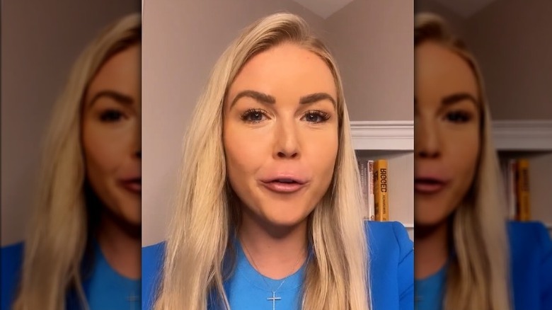 Karoline Leavitt speaks with dark eyebrows and pink lip gloss