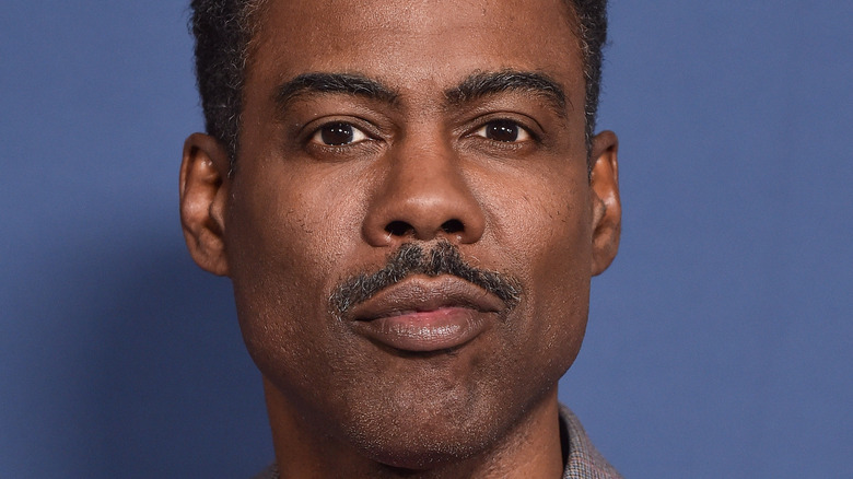 Chris Rock smirking