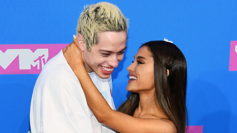 Pete Davidson and Ariana Grande attend the 2018 MTV Movie Awards
