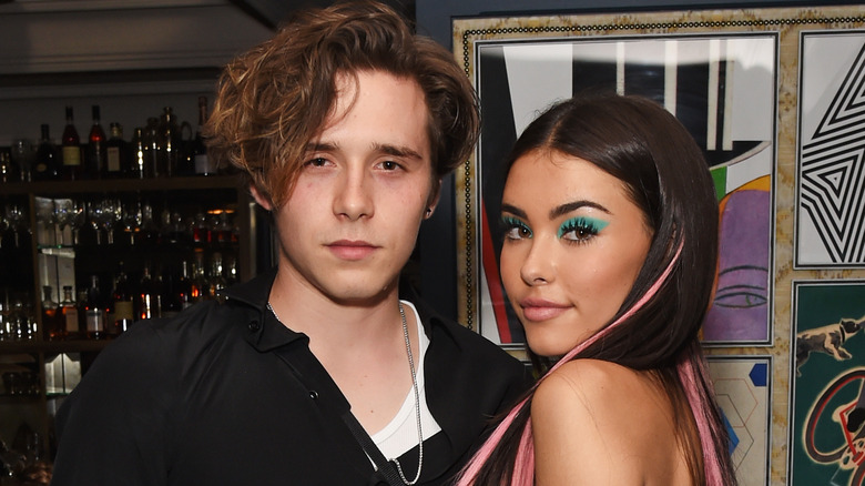 Madison Beer and Brooklyn Beckham pose together at the Wonderland Summer Issue dinner