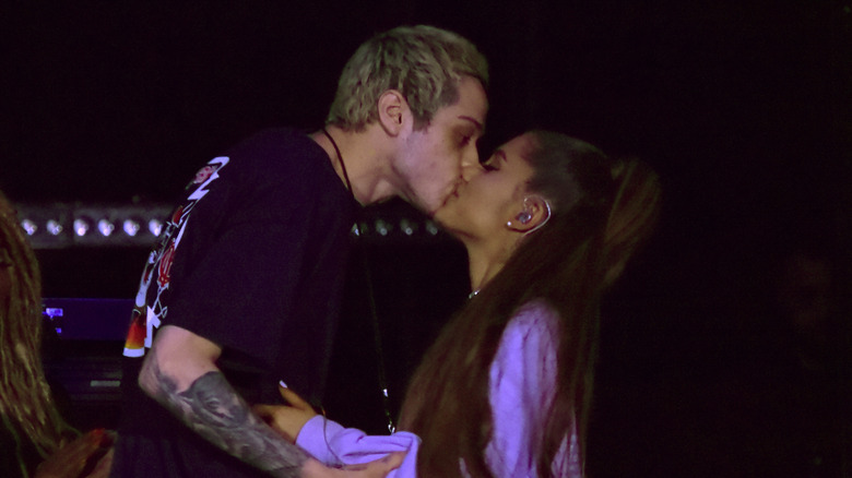 Pete Davidson and Ariana Grande kiss onstage
