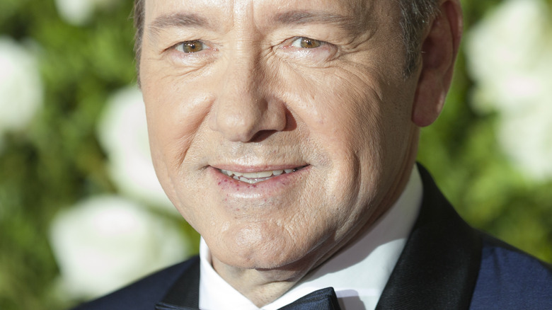 Kevin Spacey poses in a suit.