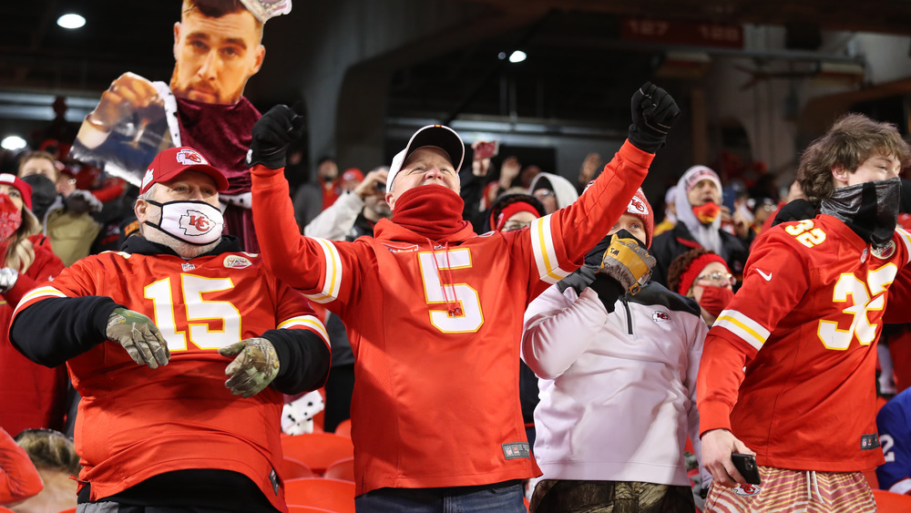 Kansas City Chiefs fans cheering at an NFL game