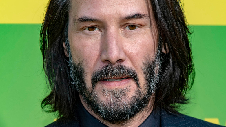 Keanu Reeves with a serious expression