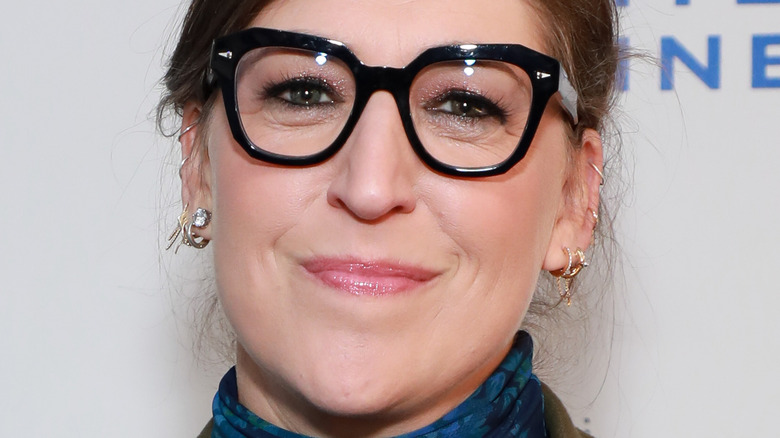 Mayim Bialik smiling with glasses on