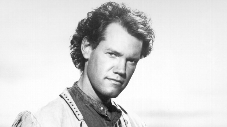 Young Randy Travis posing for a photo