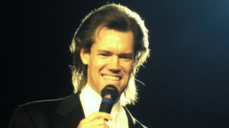Randy Travis performing in concert