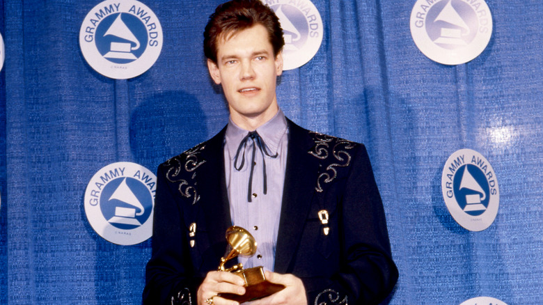Randy Travis holding his award at the 30th Annual Grammy Awards