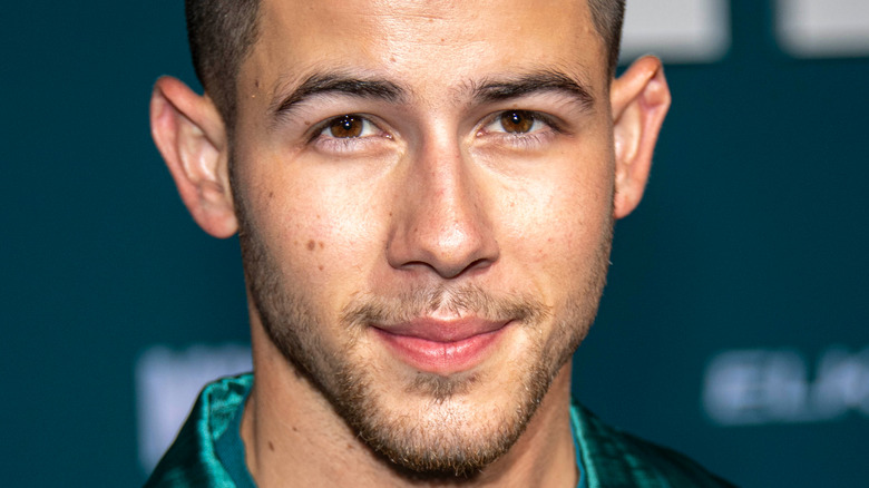 Nick Jonas looking at camera