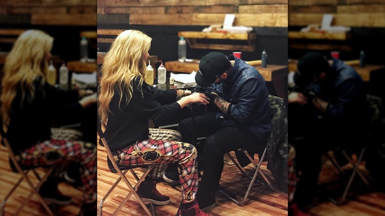 Erika Kirk pictured getting a tattoo.