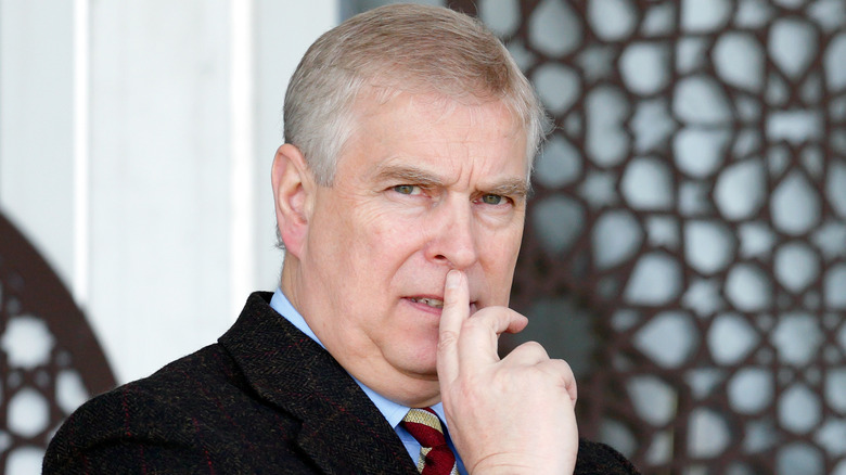 Andrew Windsor puts his hand to his mouth in 2017