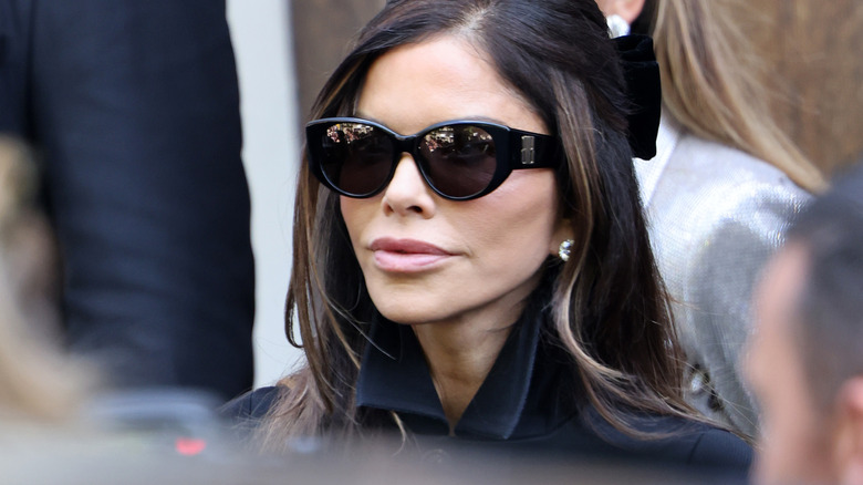 Lauren Sanchez Bezos pictured in an all-black ensemble and sunglasses.