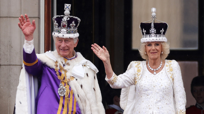 King Charles and Queen Camilla waving