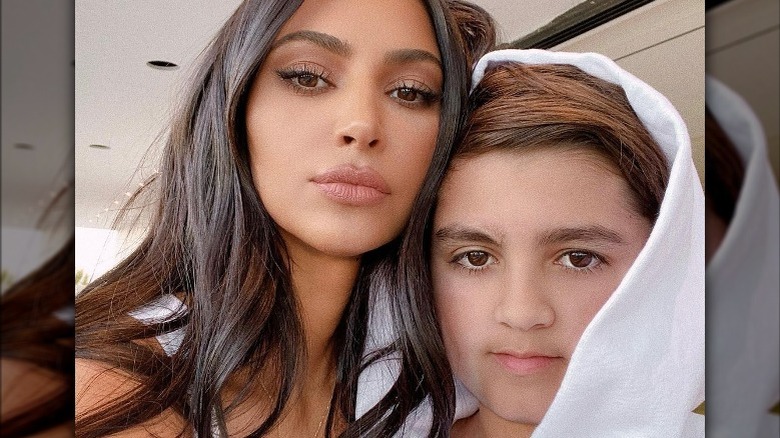 Kim Kardashian posing with Mason Disick