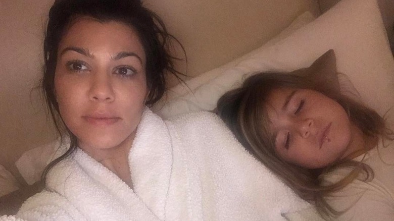 Penelope Disick asleep beside Kourtney Kardashian